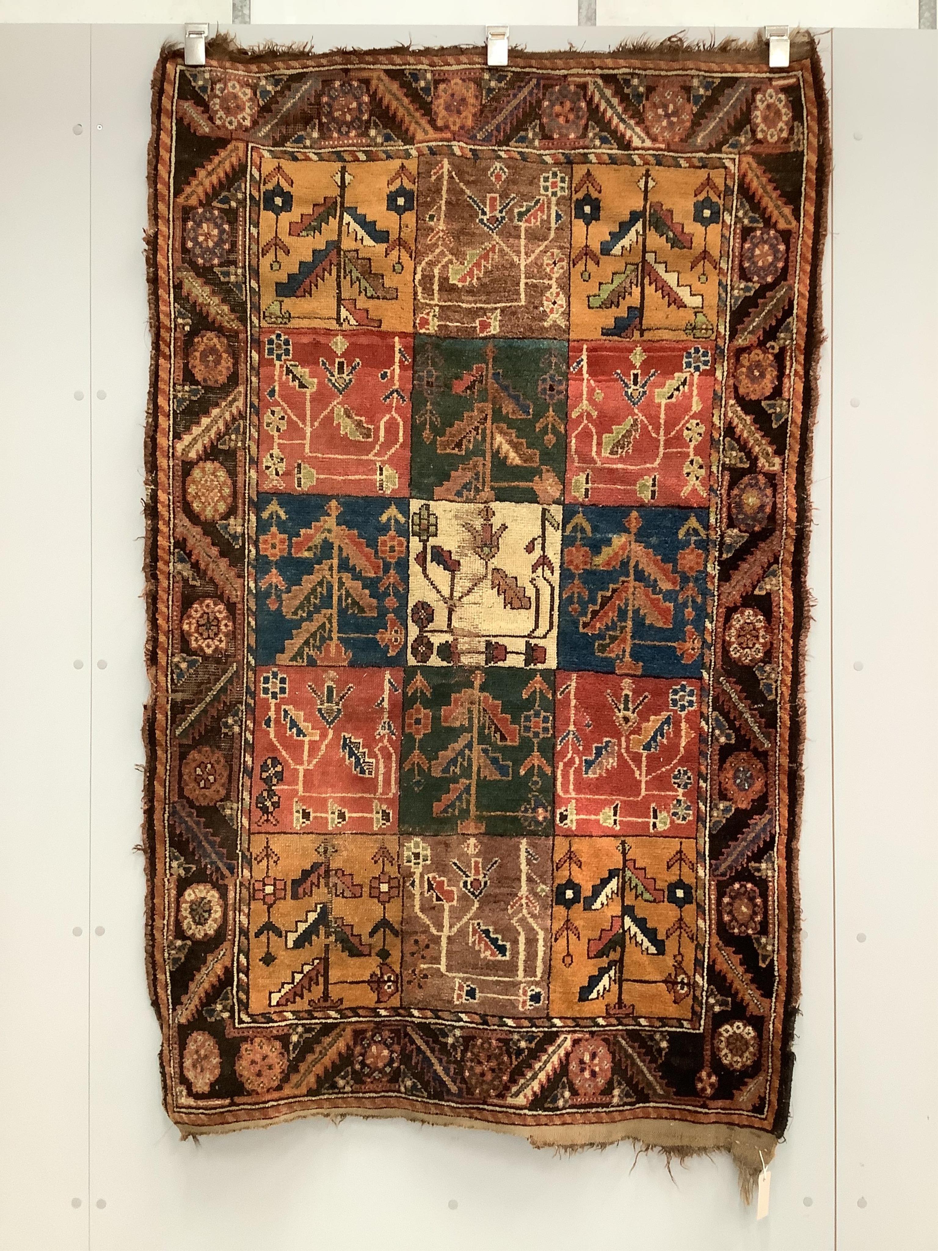 An antique Baktiari rug, 180 x 108cm. Condition - fair